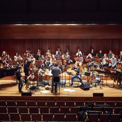 Guildhall Studio Orchestra on stage in Milton Court Concert Hall for a rehearsal